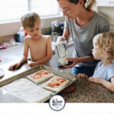 mom making pizza with her two children