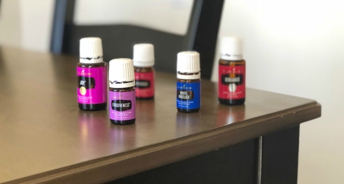 Young Living essential oils on a table. 