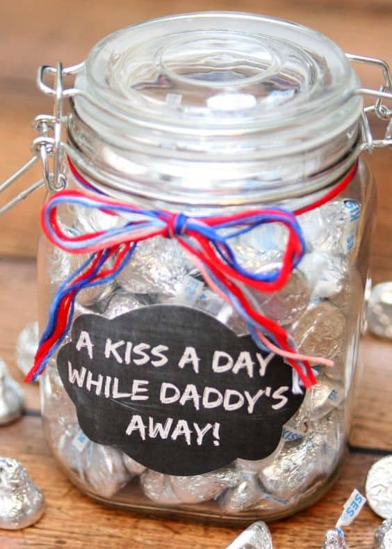 Gift and Idea. Jar of Hershey Kisses. Text: \" A kiss a day while daddy\'s away.\" 