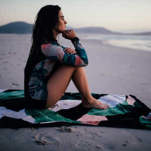A girl sitting on a beach
