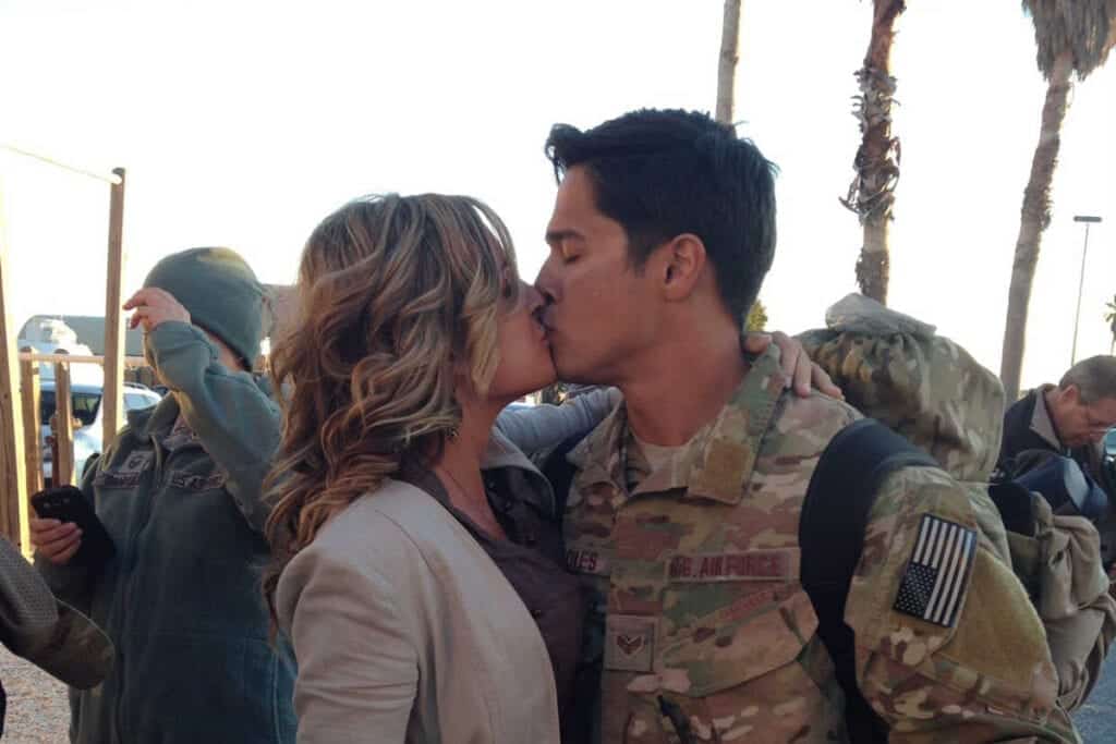 Military couple in a relationship kissing
