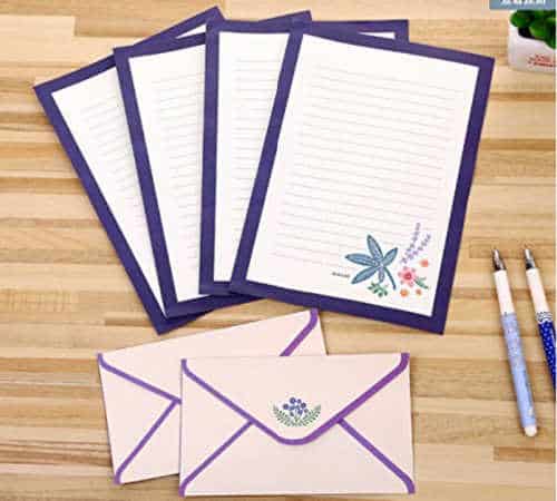 Brightly colored stationary set with purple border and blue flower as a going away gift idea. 