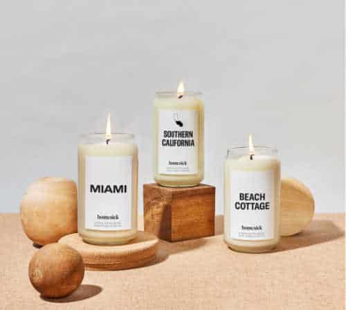 Homesick candles that are supposed to smell like the places you've been. Example candles shown: Miami, Southern California, and Beach Cottage.