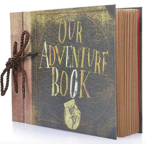 Personal photo book gift with cover text that reads "our adventure book." 