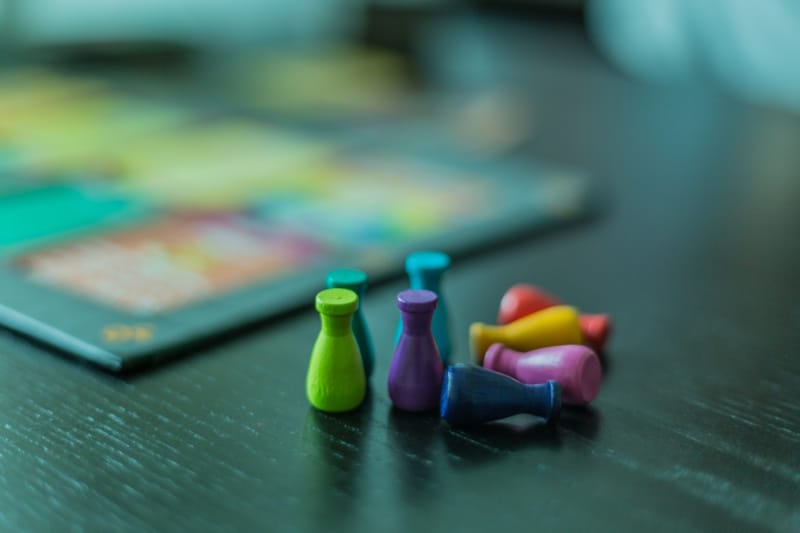 blurred board game. Colorful game pieces.