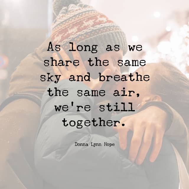Couple embracing for a kiss with text overlay that reads: "As long as we share the same sky and breathe the same air, we're still together." Donna Lynn Hope
