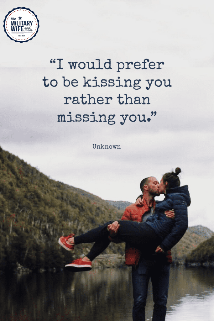 Couple kissing in front of lake and mountains with missing him quote overlayed on photo.