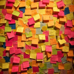 Post it notes stuck all over the wall with ideas.