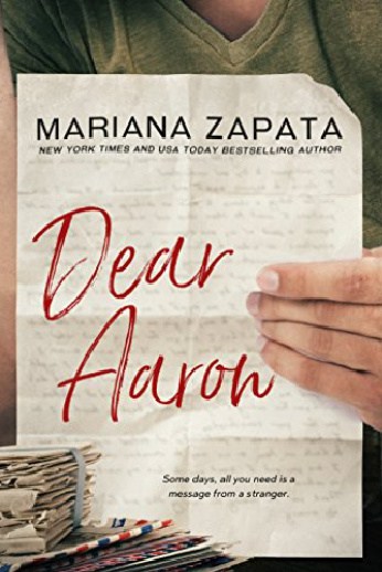 book cover with letters and hand holding a letter up